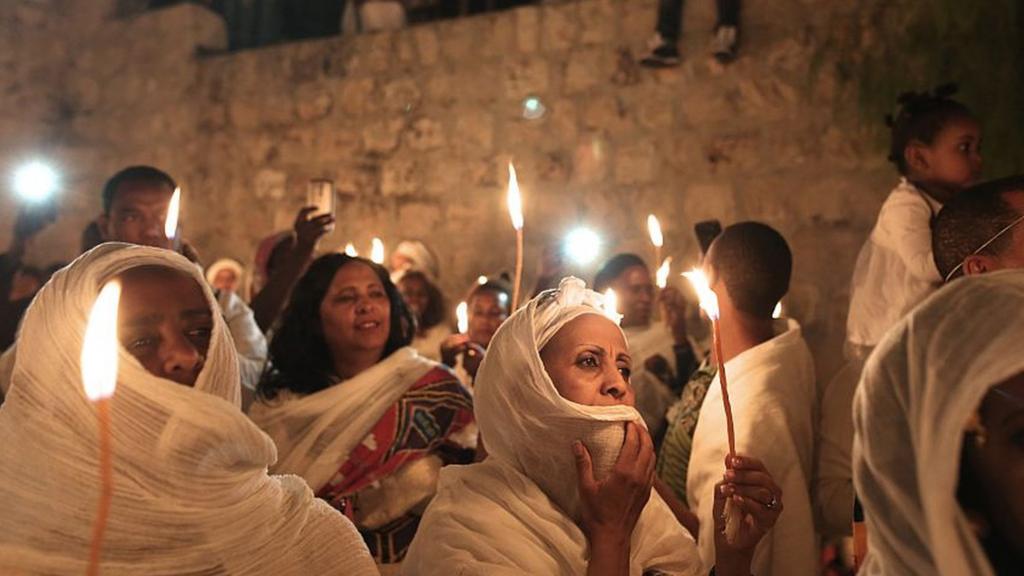 - Ethiopian Christian pilgrims hold candles