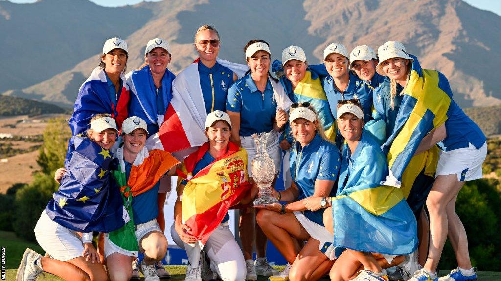 Europe's Solheim Cup team with trophy after retaining title in Spain