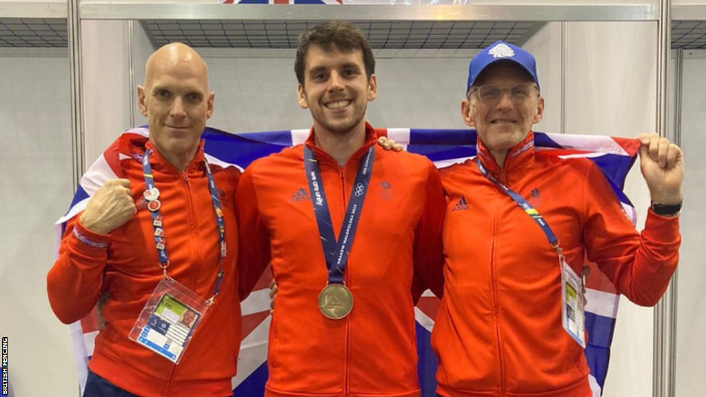 William Deary poses with his fencing medal