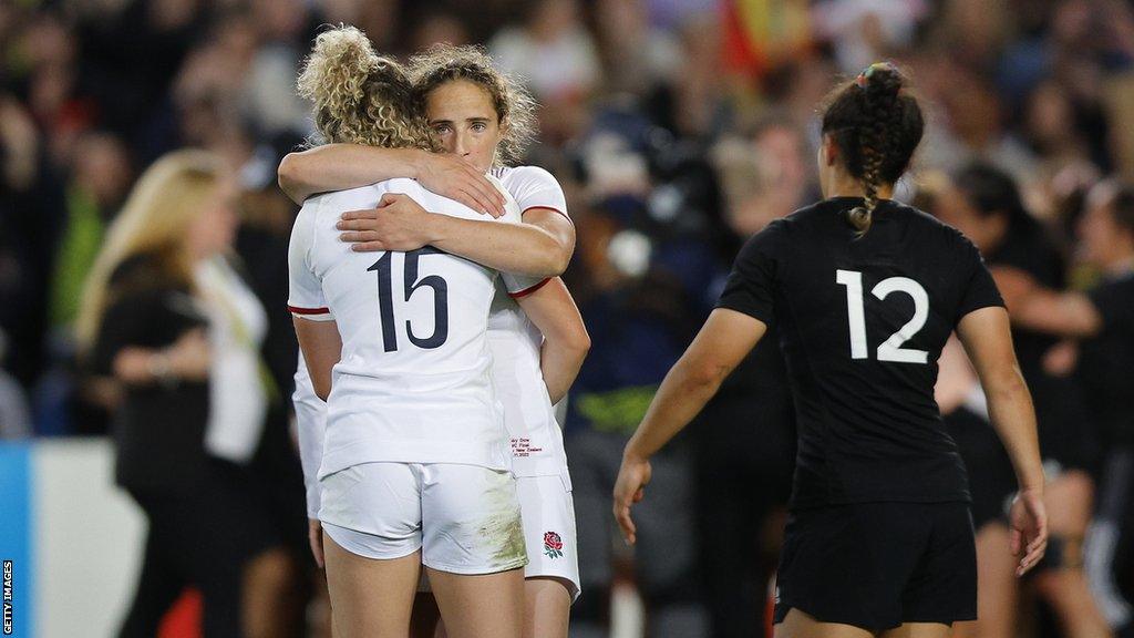 England players embrace after losing the 2022 women's Rugby World Cup final to New Zealand