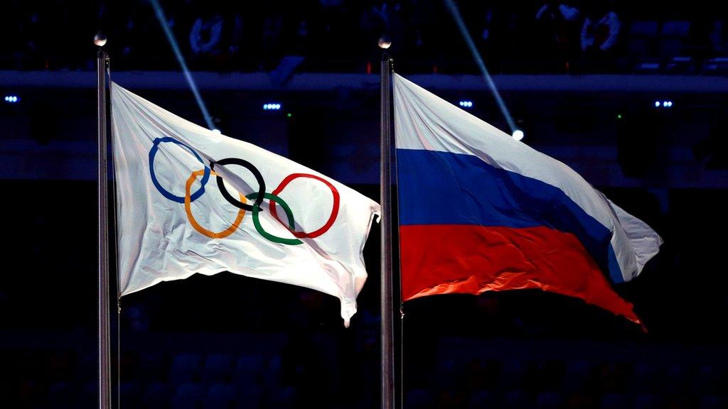 Olympic flag and Russian flag