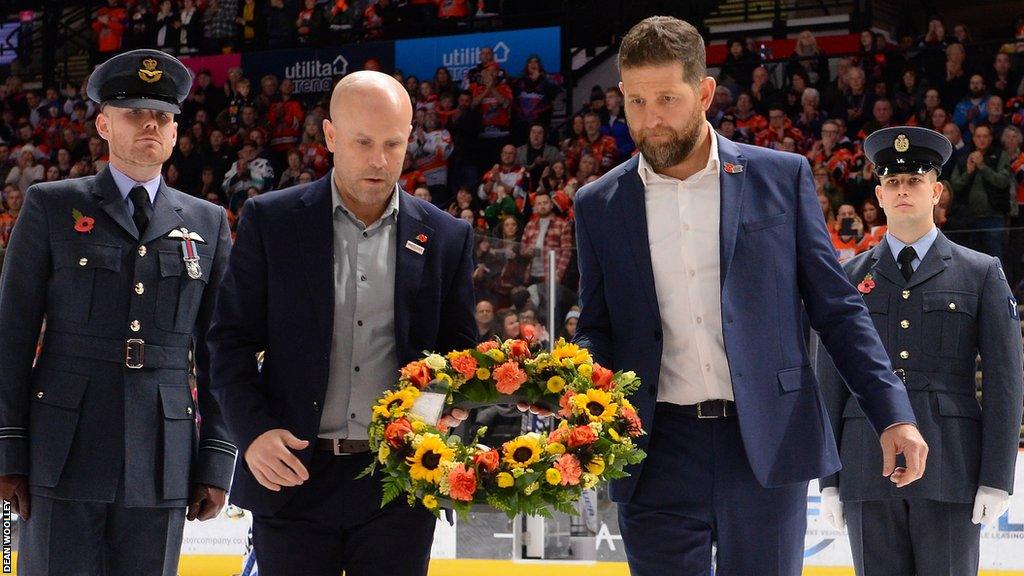 Steelers head coach Aaron Fox and Coventry head coach Danny Stewart lay a wreath for Adam Johnson