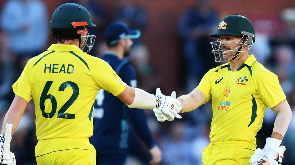 Travis Head and David Warner of Australia shake heads