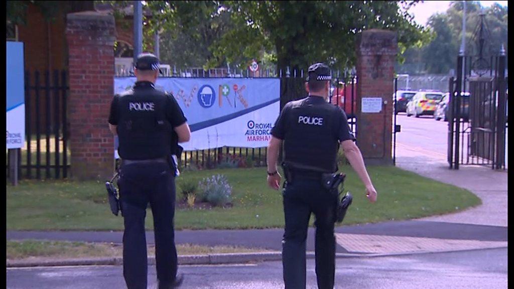 Police officers outside RAF Marham