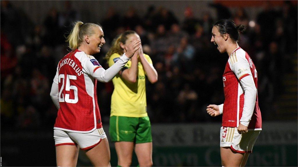 Stina Blackstenius moves to high five teammate Lotte Wubben-Moy after scoring the third goal.