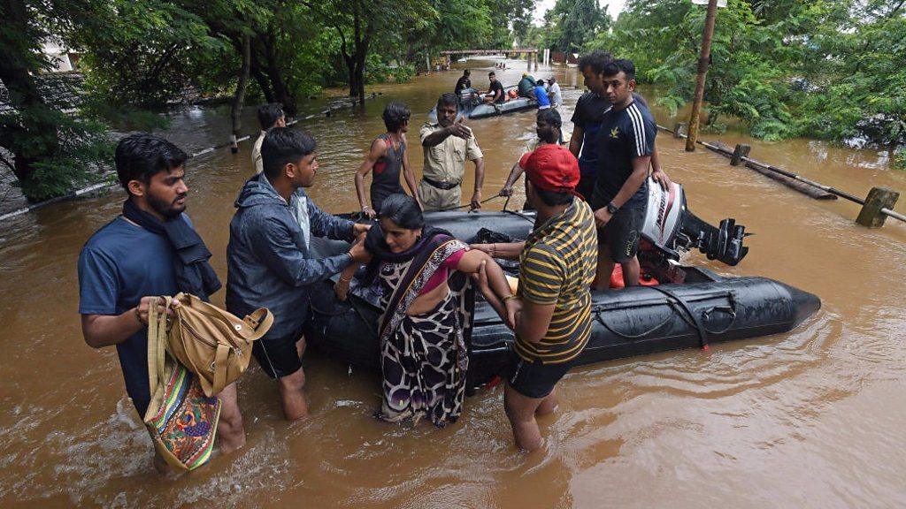 Woman rescued from flooding