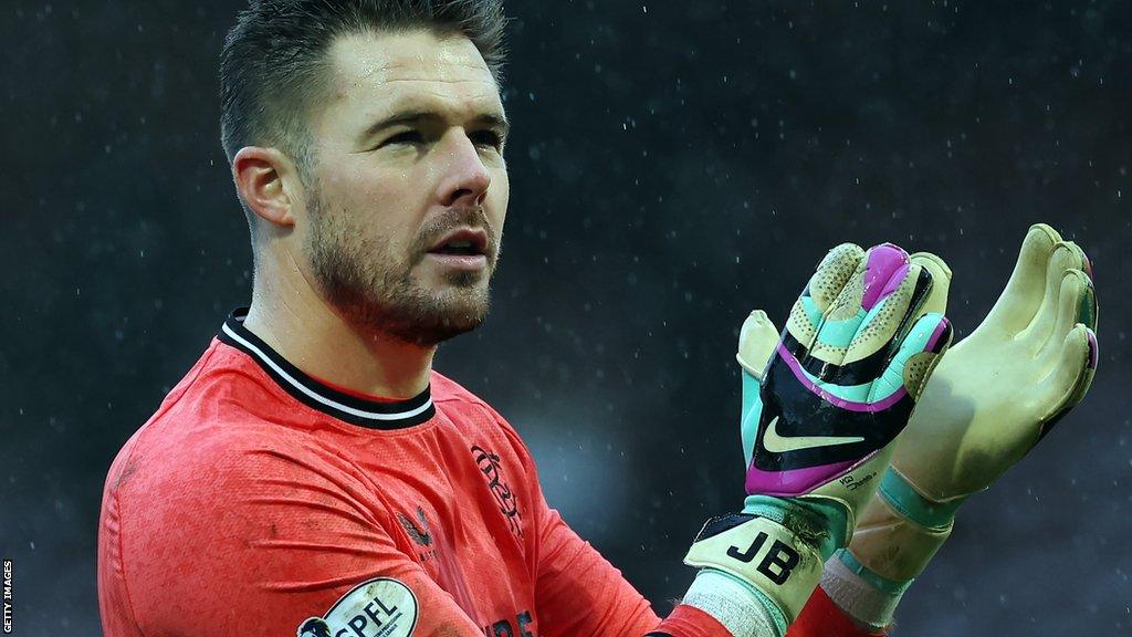 Rangers goalkeeper Jack Butland claps his hands