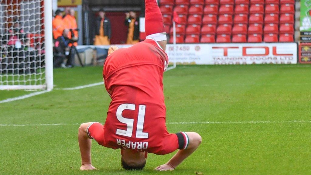 Freddie Draper celebrates with a forward roll