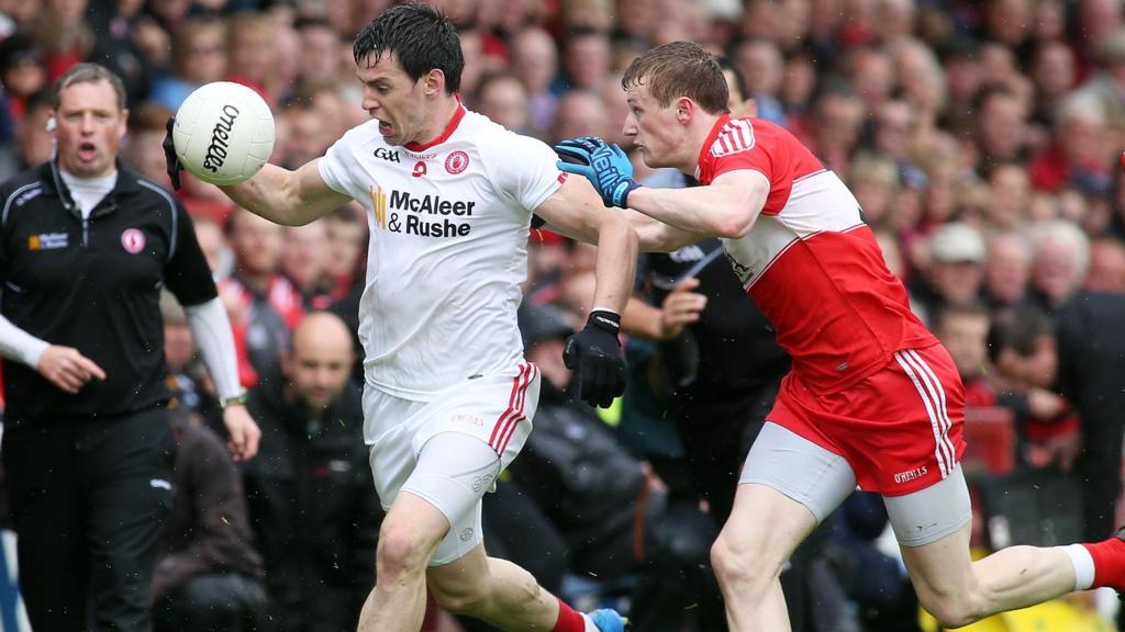 Tyrone's Matthew Donnelly and Derry's Brendan Rogers