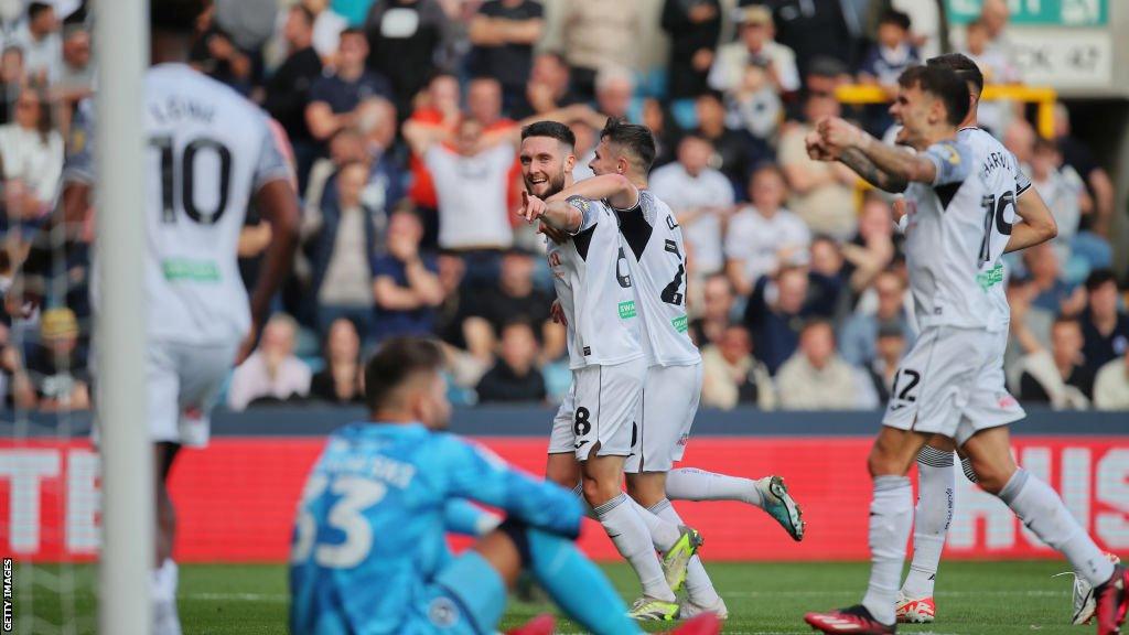 Matt Grimes celebrates with Swansea City team mates