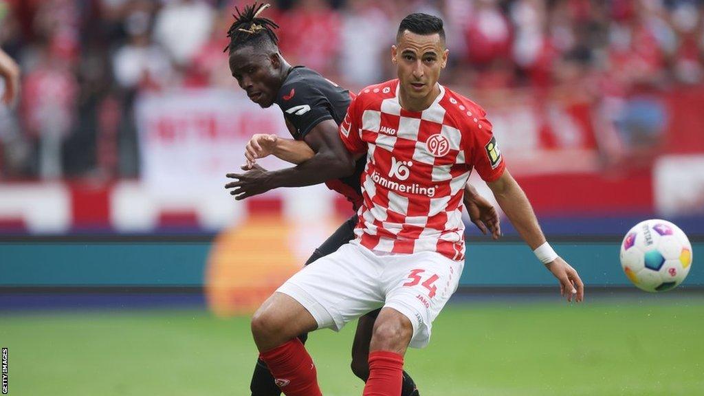 Anwar El Ghazi being tackled by Odilon Kossounou during Mainz v Bayer Leverkusen in September