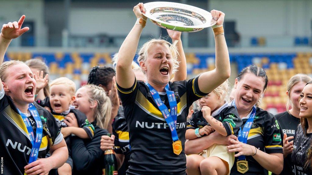 Tara Jane Stanley lifts the League Leaders' Shield aloft for York after their win over Huddersfield