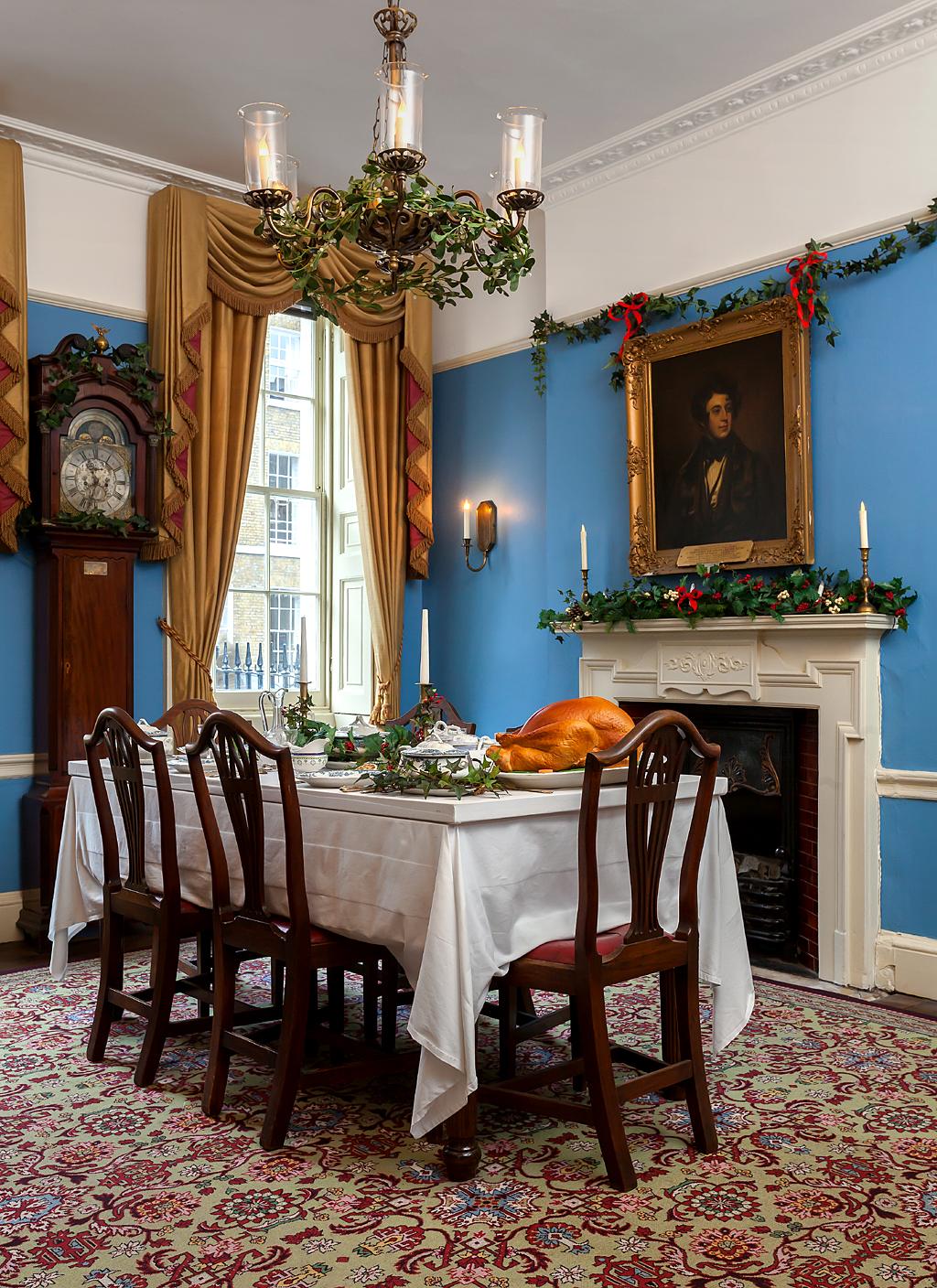 Dining table laid for Christmas Dinner - Dickens Museum