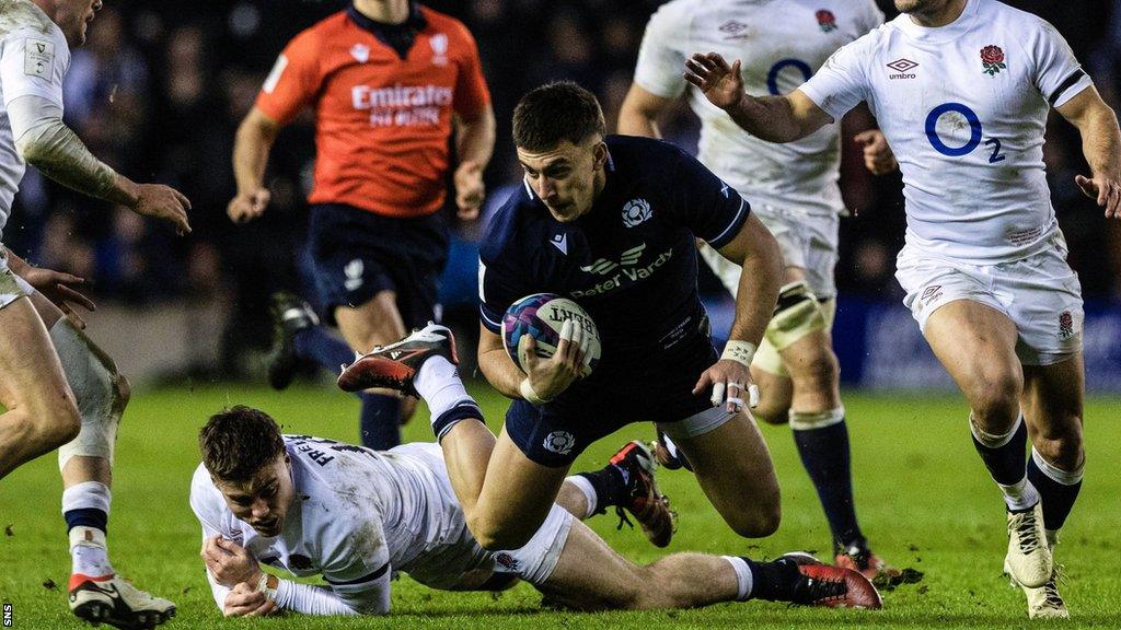 Scotland centre Cameron Redpath tries to break the England defensive line