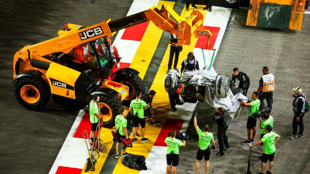 George Russell's stricken Mercedes is removed from the track