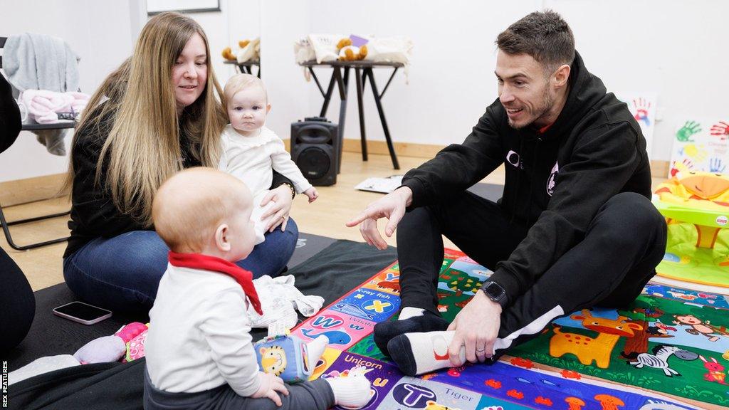 Doncaster's Tommy Rowe (right) takes on childminding duties