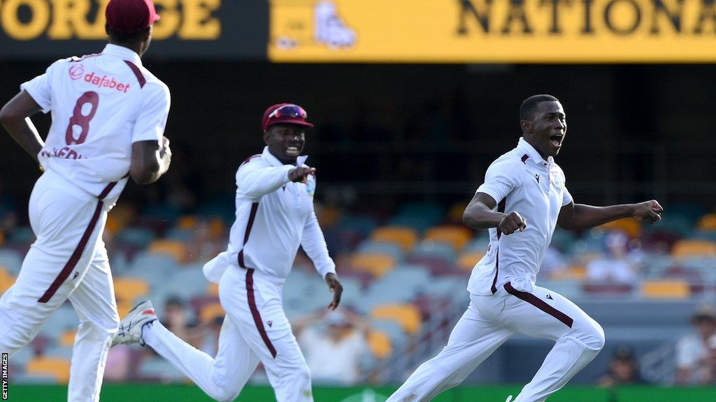 Shamar Joseph celebrates the winning wicket