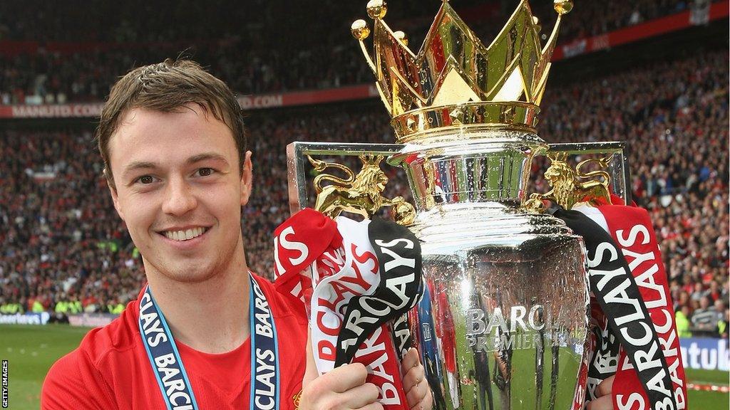 Central defender Jonny Evans with the Premier League trophy in 2009