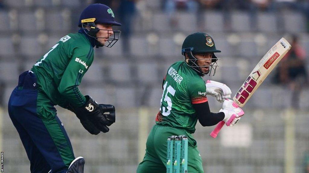 Mushfiqur Rahim in action for Bangladesh as Ireland wicket-keeper Lorcan Tucker looks on