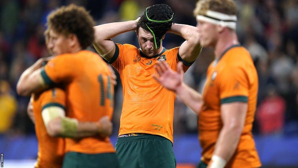 Australia players dejected after a Rugby World Cup defeat