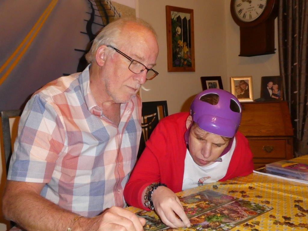 Amy and her father doing a jigsaw