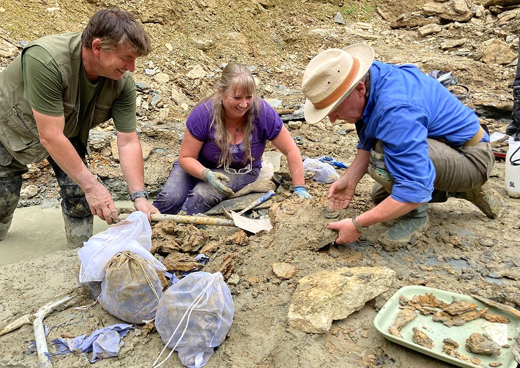 Neville, Sally and Mark work to free fossils