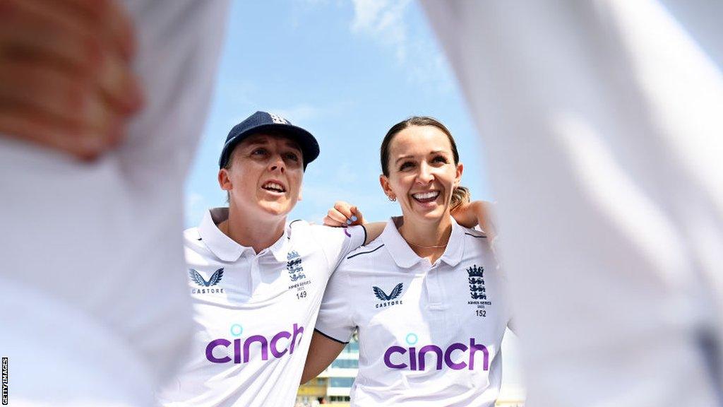 England captain Heather Knight and Kate Cross in a team huddle before their Ashes Test against Australia