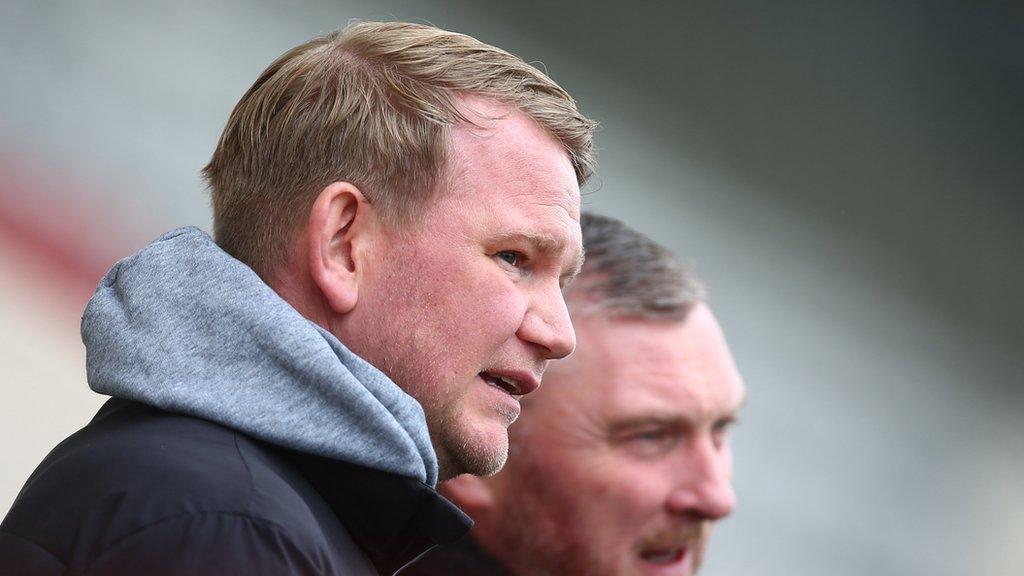 Barrow boss Pete Wild watching a match