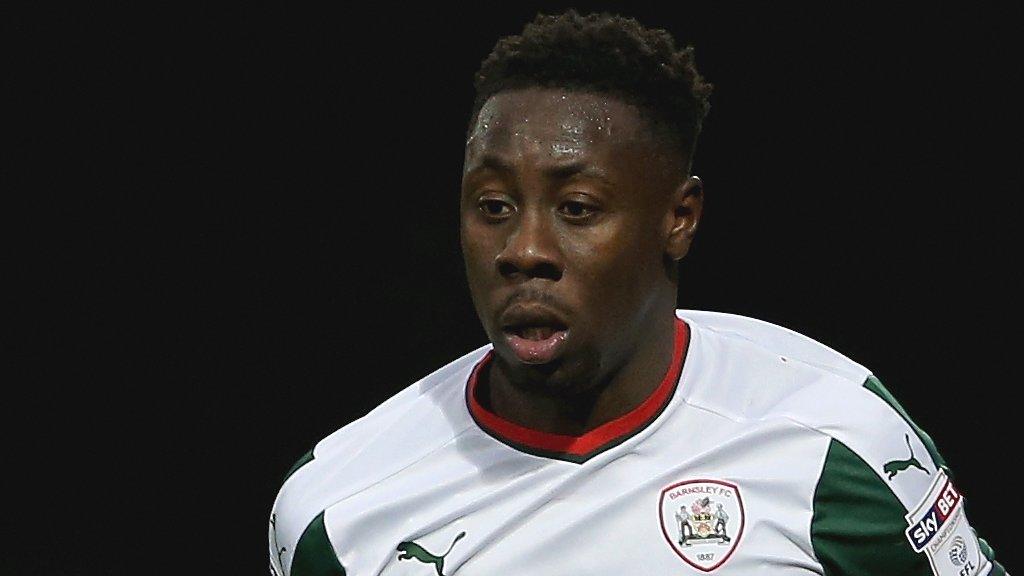 Barnsley full-back Andy Yiadom runs with the ball against Brentford