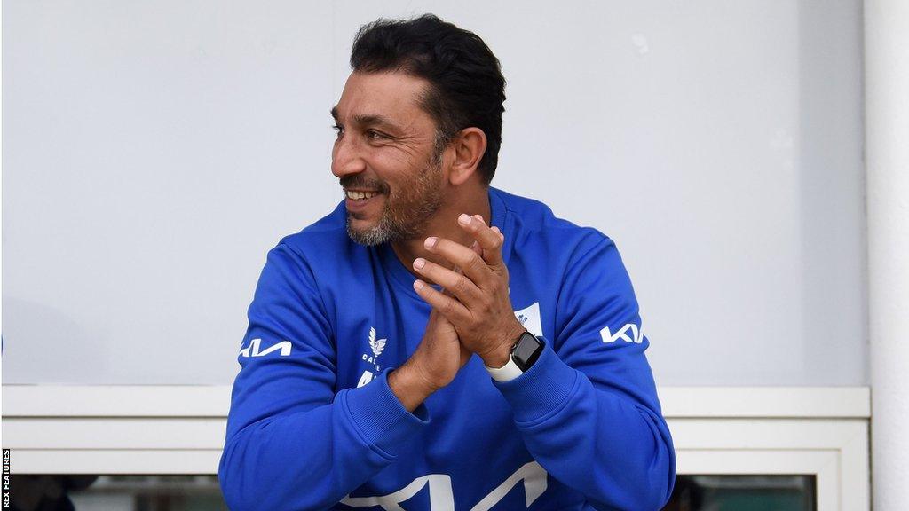 Azhar Mahmood sitting down during a Surrey match