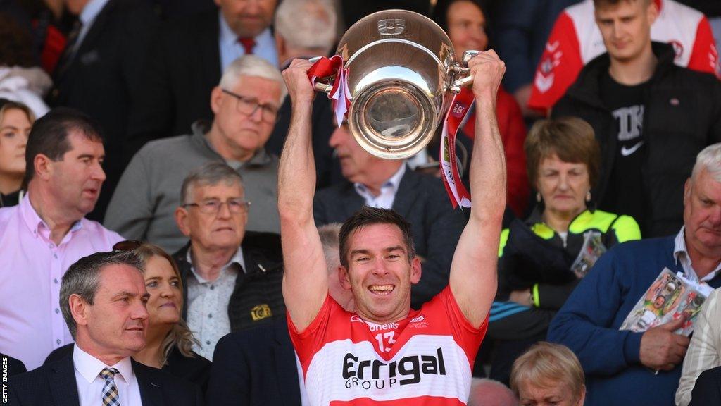 Benny Heron lifts the Anglo Celt Cup at St Tiernach's Park in Clones, Monaghan.