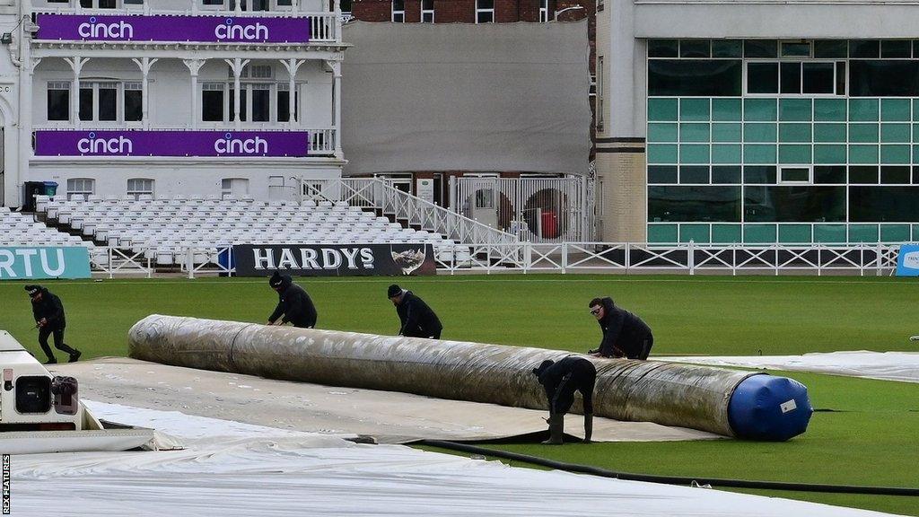 Trent Bridge groundstaff mopping up