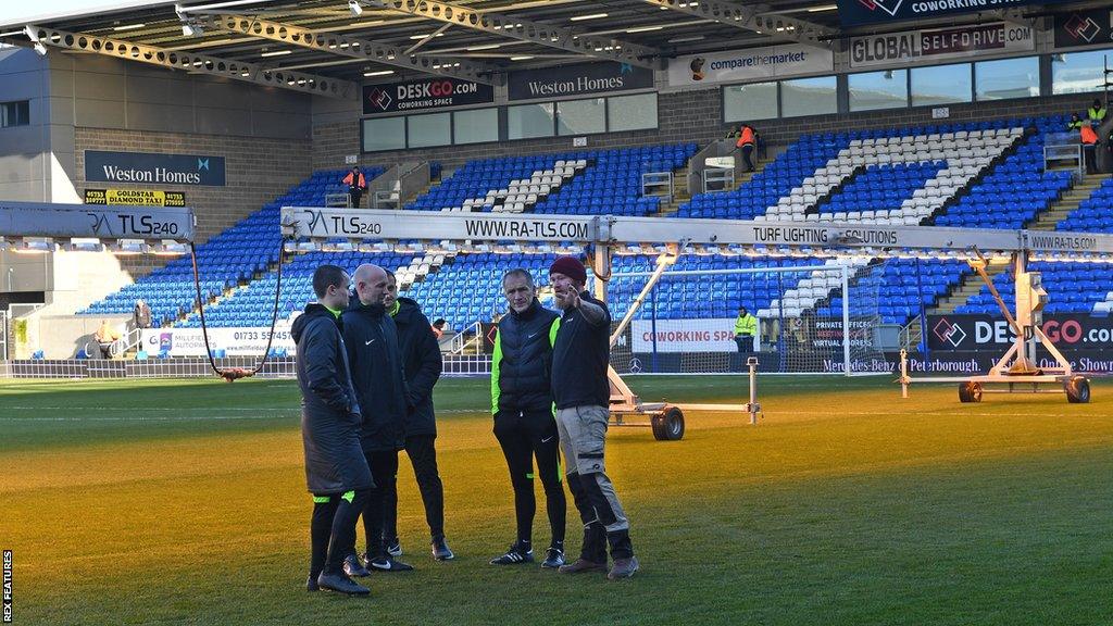 Peterborough used heat lamps in an attempt to get the match on but the surface failed an inspection from officials