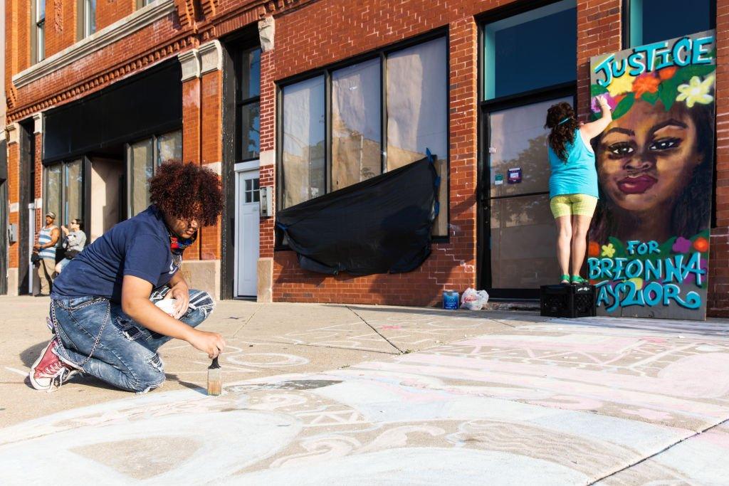 Street artists create work in memory of Breonna Taylor on 6 June in Chicago, Illinois