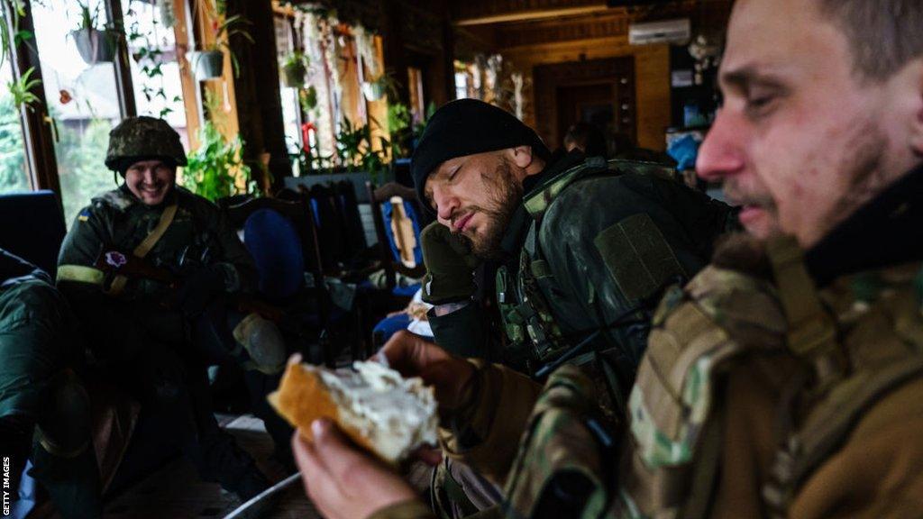 Yaroslav Amosov with fellow Ukrainian soldiers in Irpin in 2022