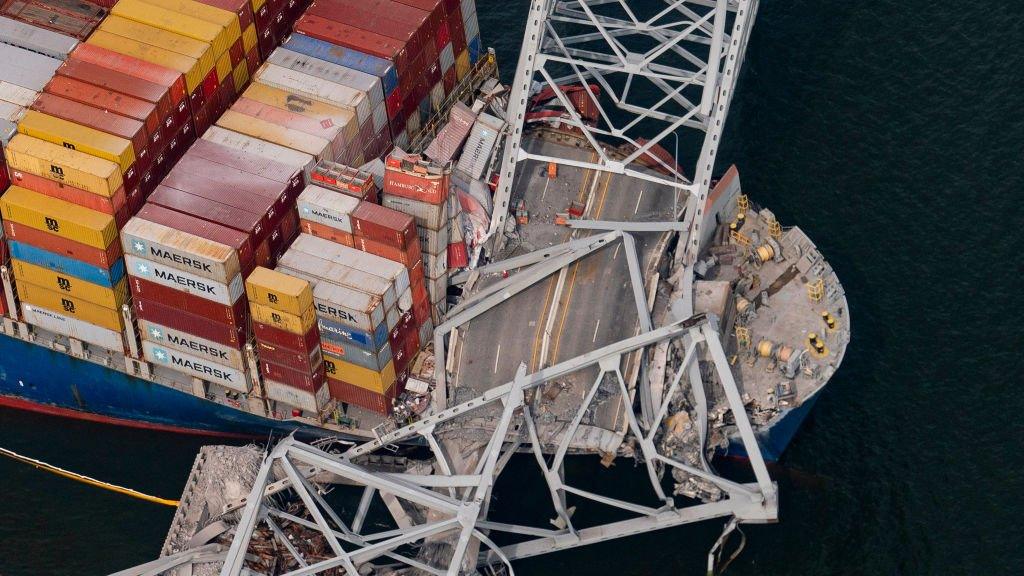 Picture of the Francis Scott Key Bridge lying on top of the cargo ship in the Baltimore port.