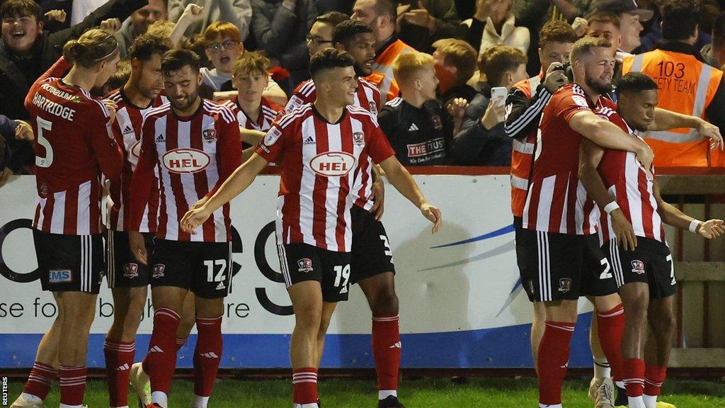 Exeter City celebrate Demetri Mitchell's winning goal against Luton Town