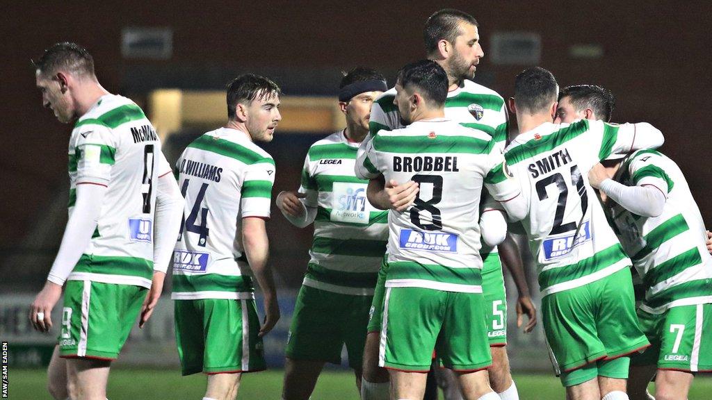 Saints players celebrate Ryan Astles' late winner against Bala Town