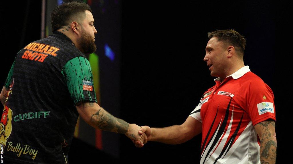 Gerwyn Price congratulates Michael Smith on his win in Cardiff