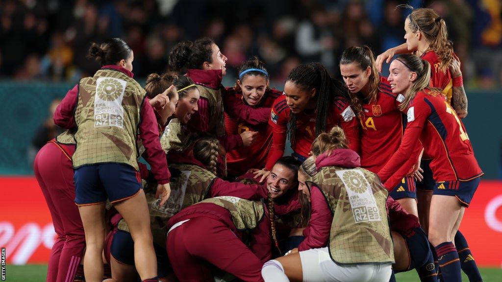 Spain players celebrate reaching the World Cup final with victory over Sweden