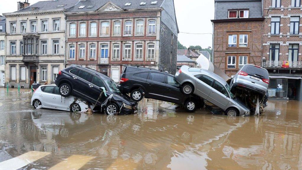 Cars stacked on top of each other around a roundabout in Verviers, Belgium