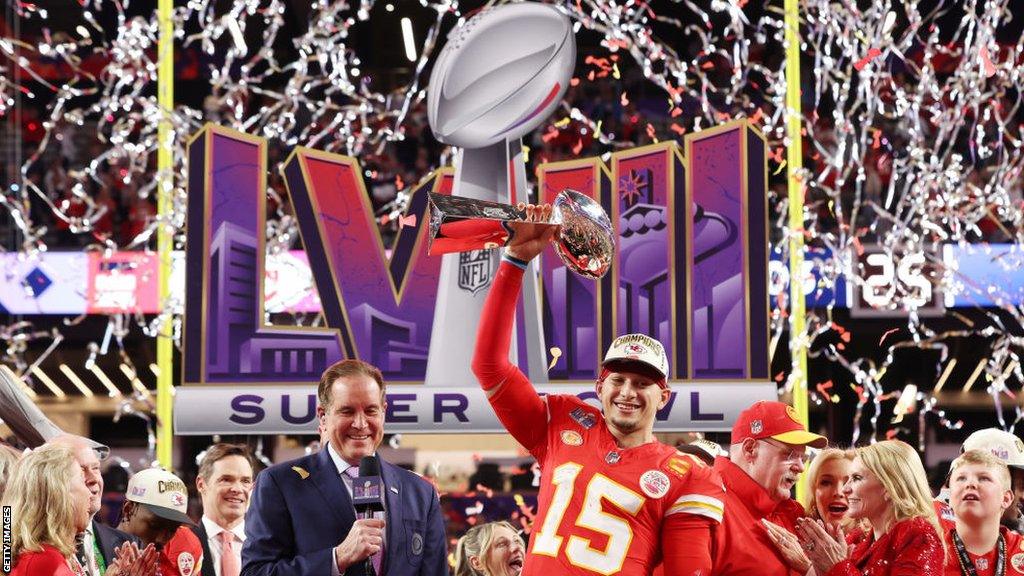 Patrick Mahomes holds the trophy