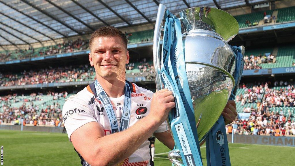 Owen Farrell holding the Premiership trophy in May