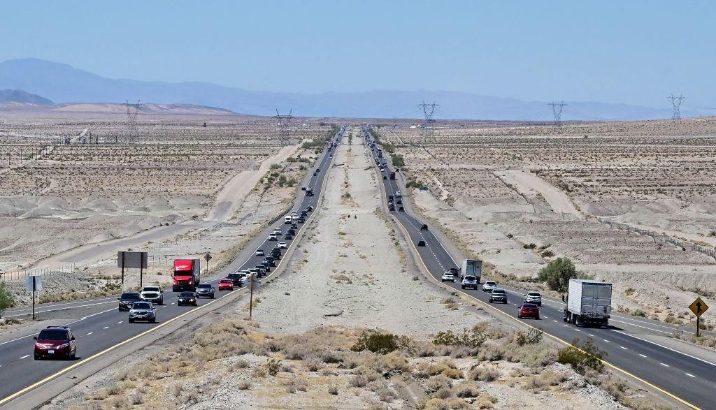 Vehicles make their way across the Mojave desert outside of Baker, California on July 11, 2023 amid excessive heat warnings