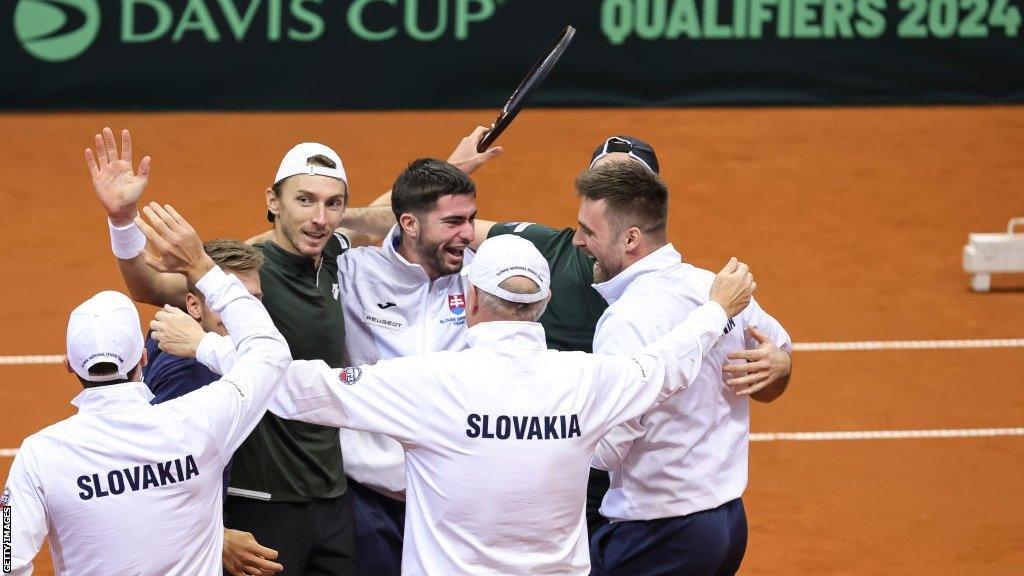 Slovakia celebrate after beating Serbia