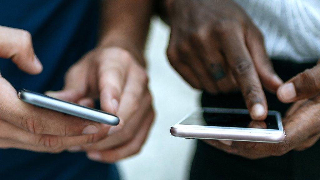 Stock image of two people messaging