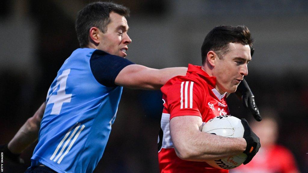 Derry substitute Gareth McKinless attempts to break clear of Dublin's Dean Rock