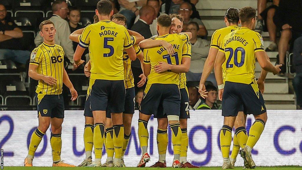 Oxford United celebrate after scoring a goal in their League One match versus Derby County.