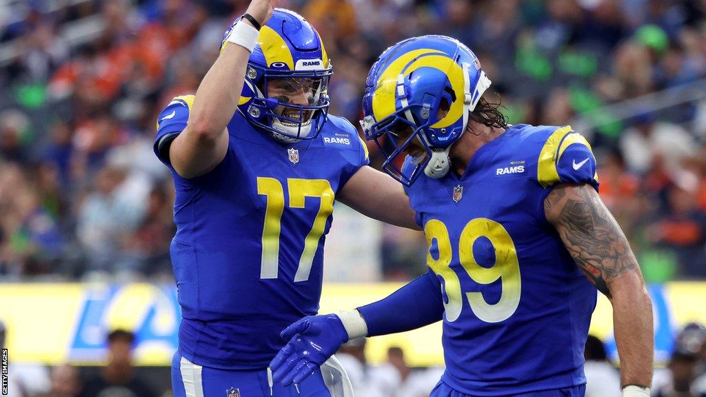 Baker Mayfield (left) celebrates a touchdown