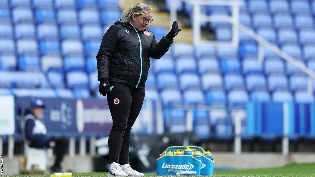 Kelly Chambers gestures to her players on the sidelines